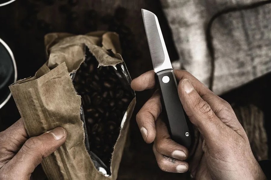 a hand holding a knife