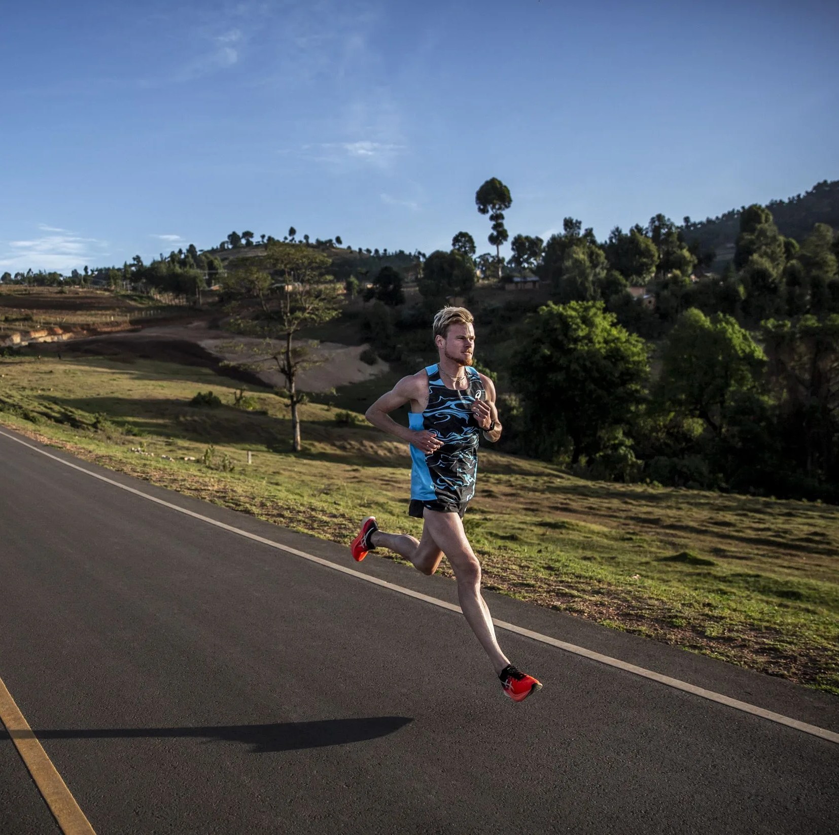 a man running on an empty road