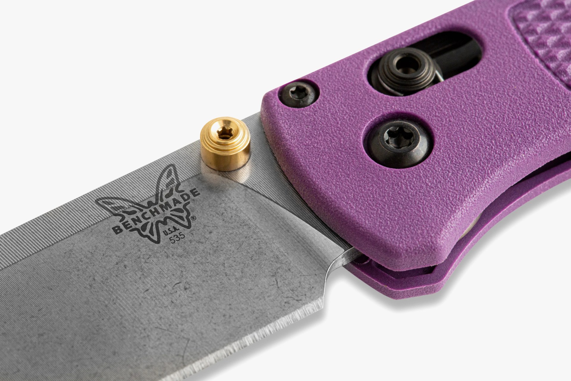 a close up of a folding pocket knife's joint, blade, and handle