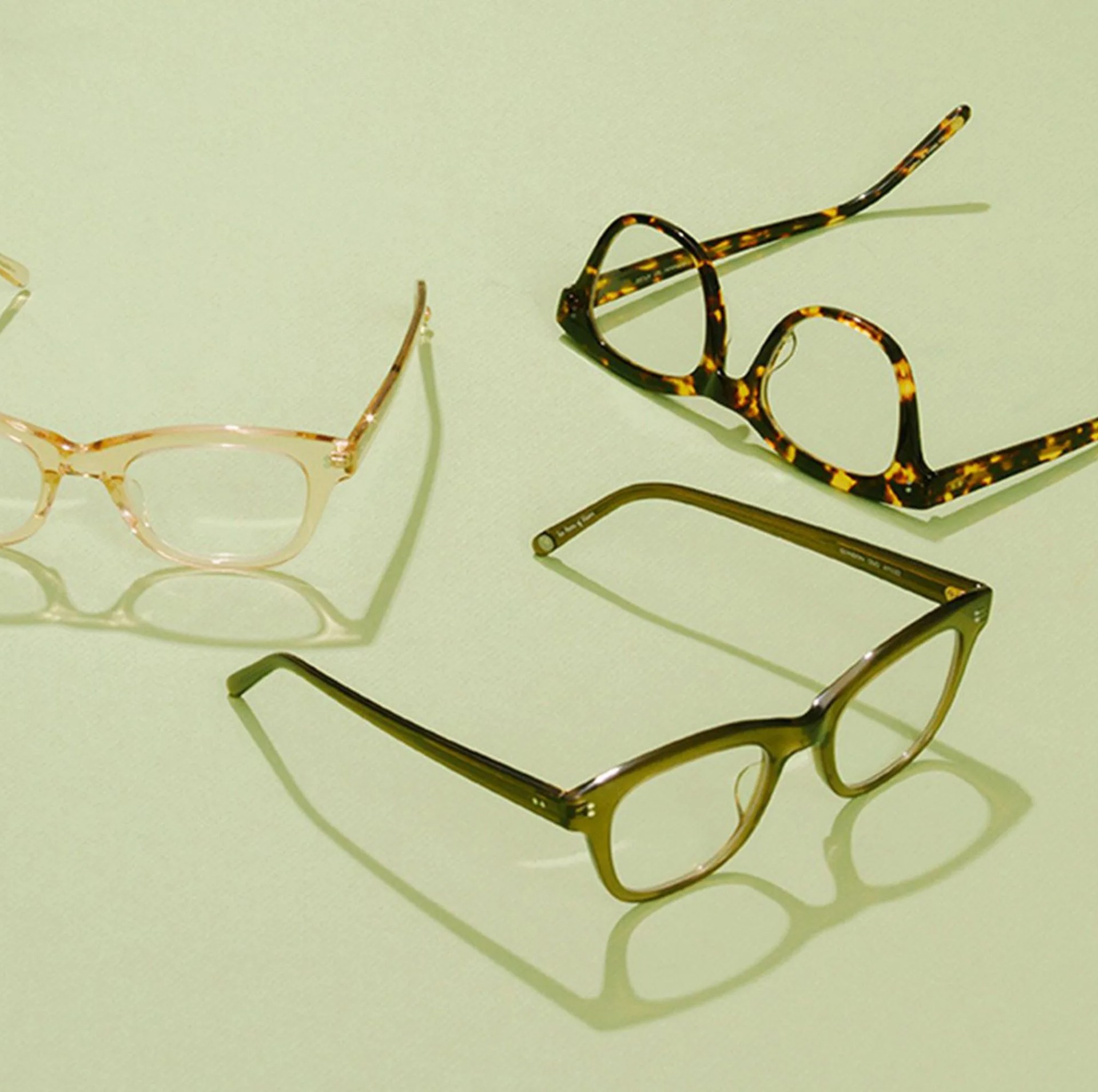 glasses on green background