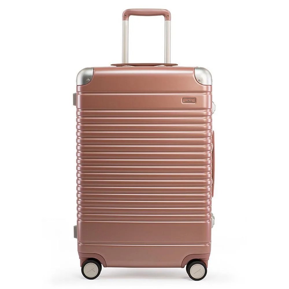 The Frame Check In rose gold luggage