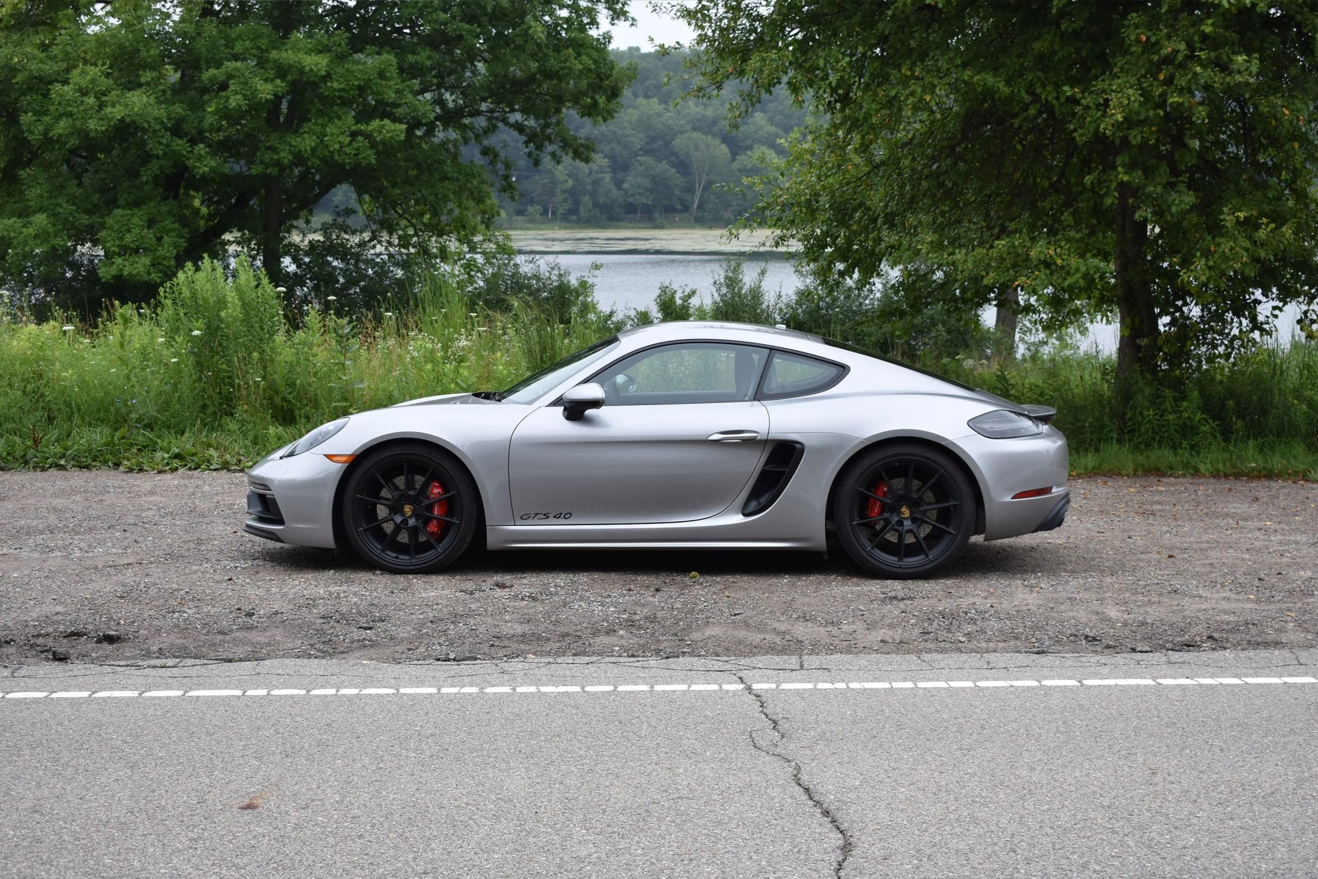 silver porsche cayman gts 4 side