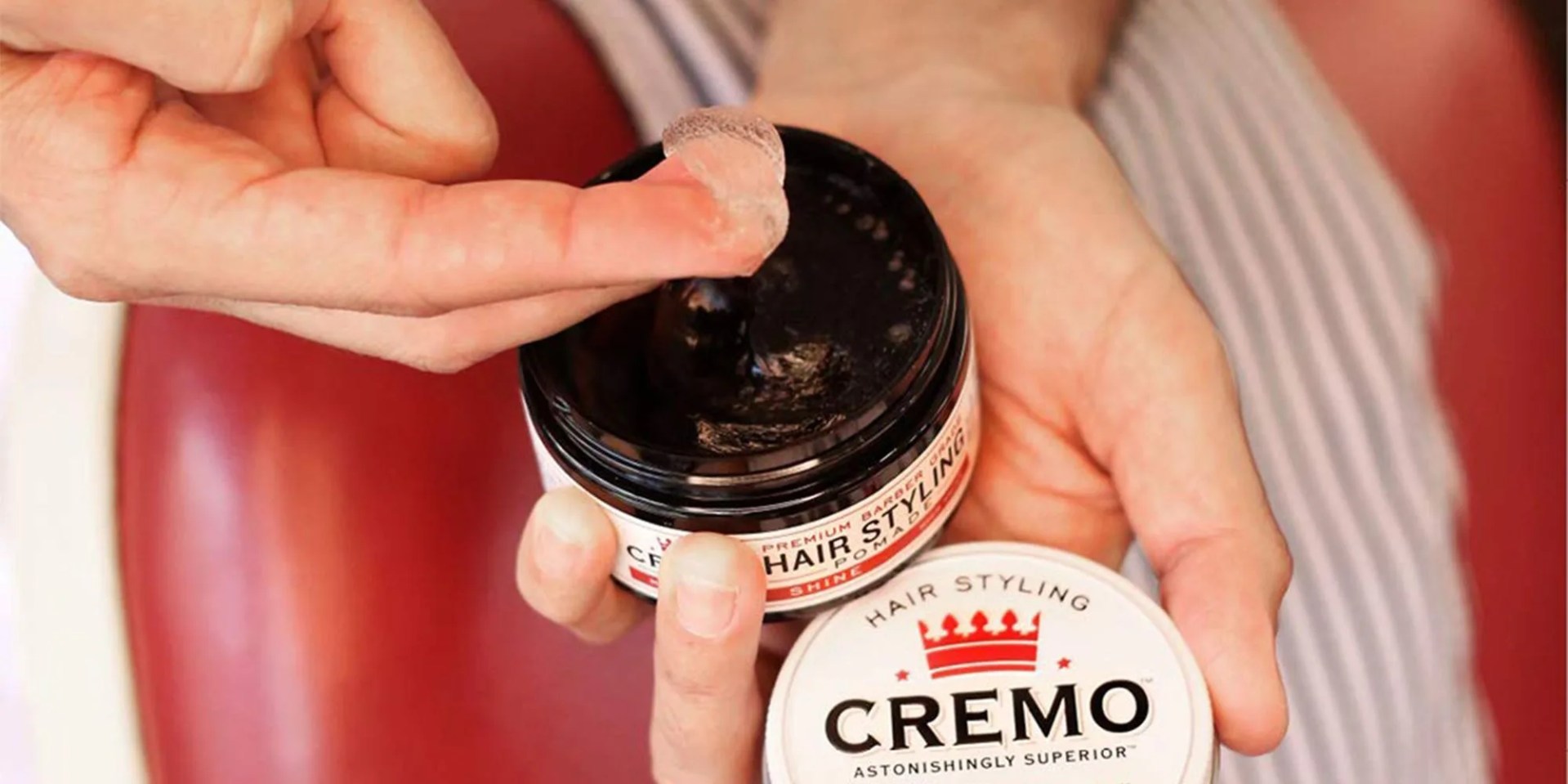 person using cremo pomade