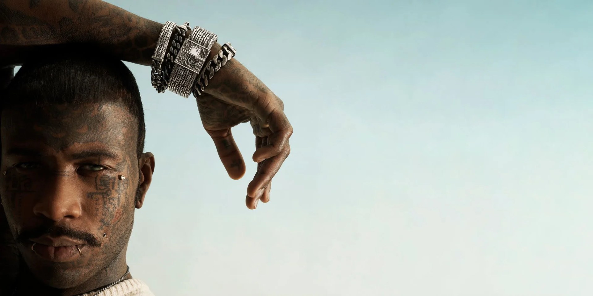 man wearing john hardy bracelets