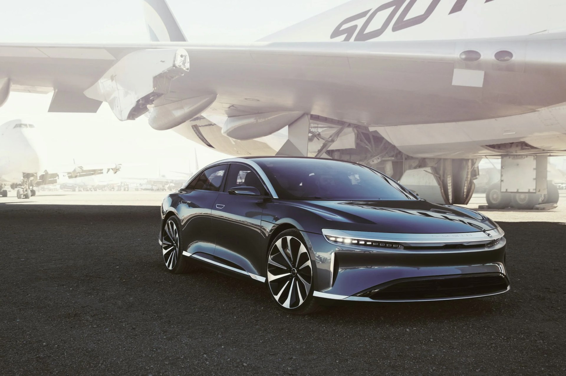 lucid motors air ev with plane