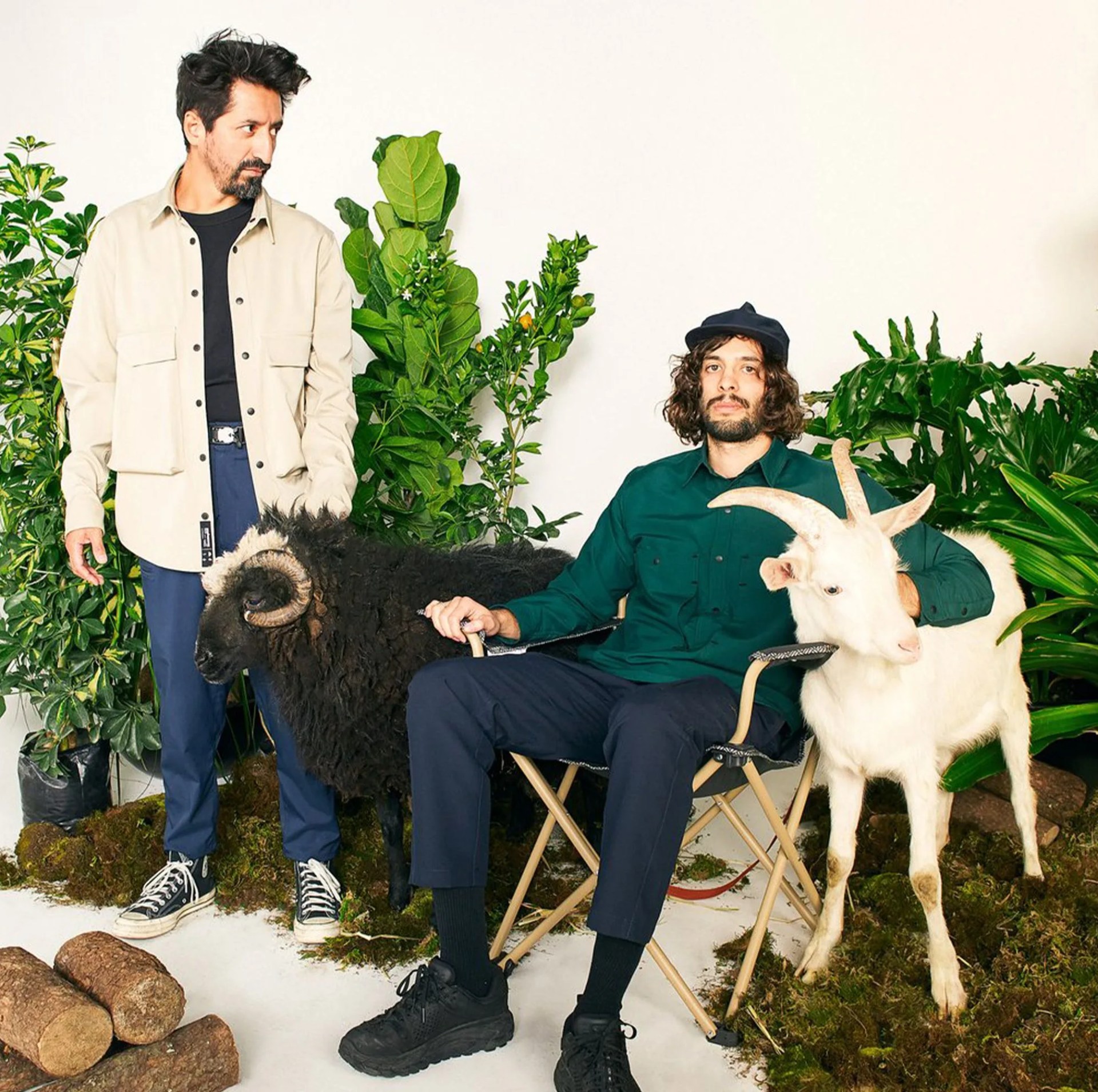 two men and two goats