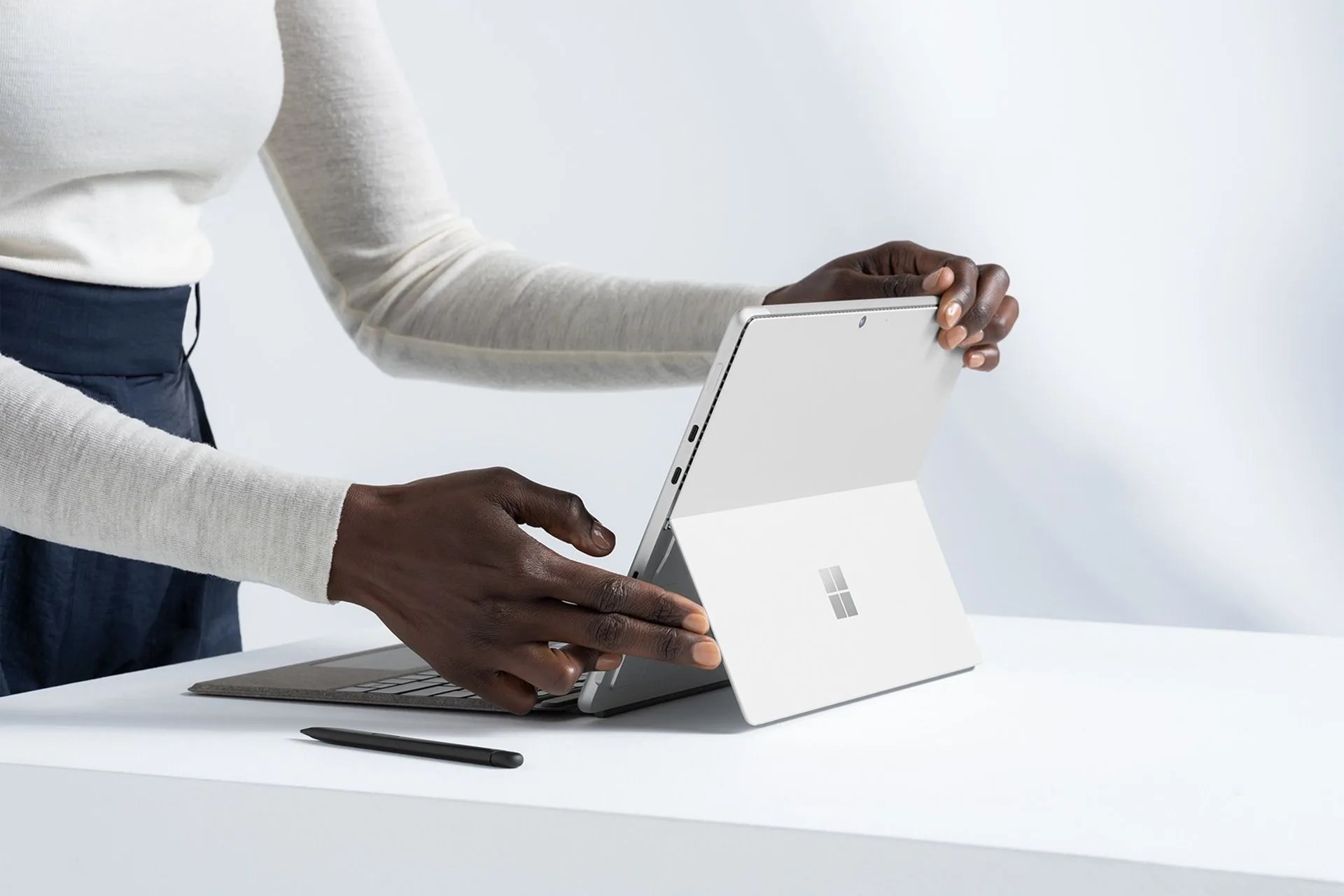 woman using microsoft surface pro 8