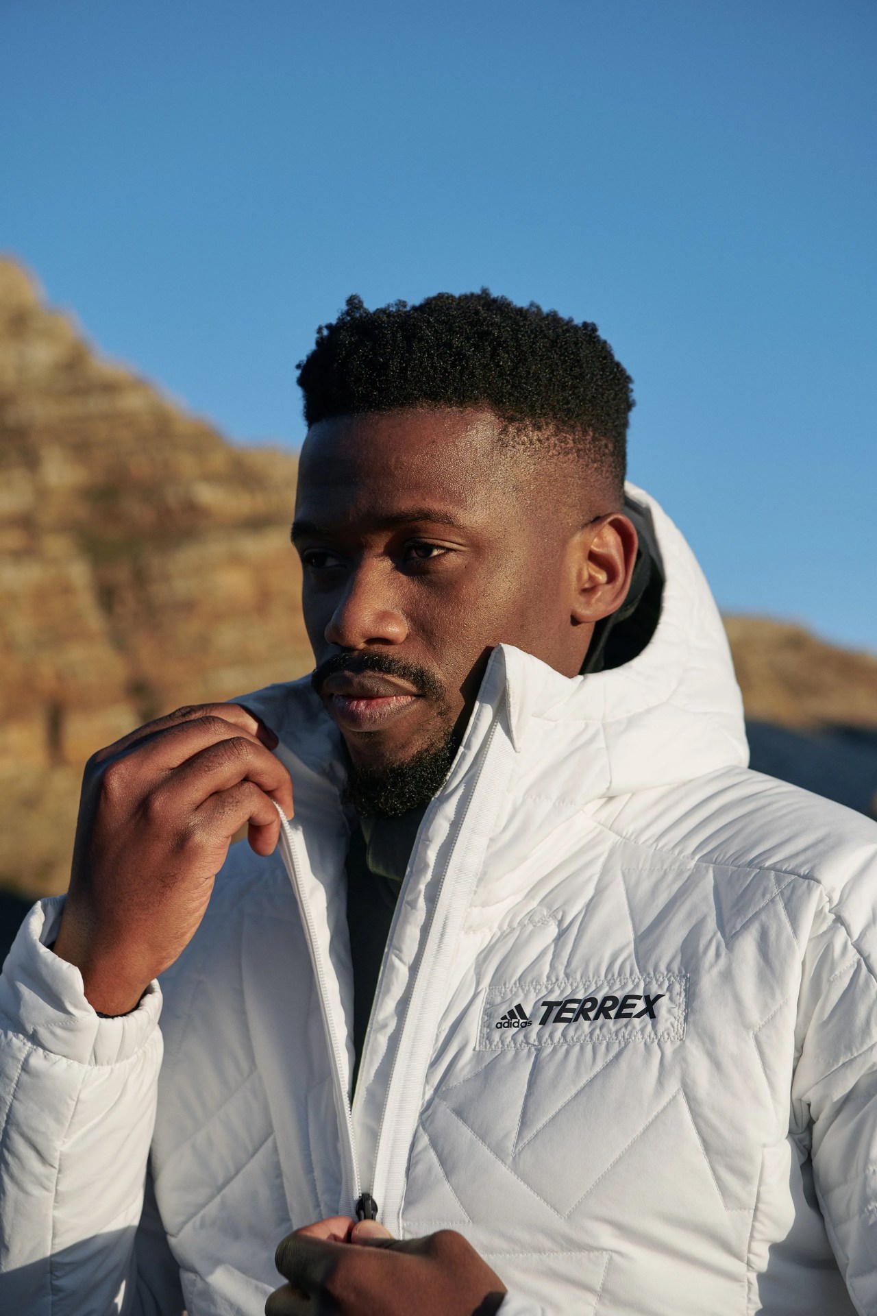 man wearing adidas terrex outfit