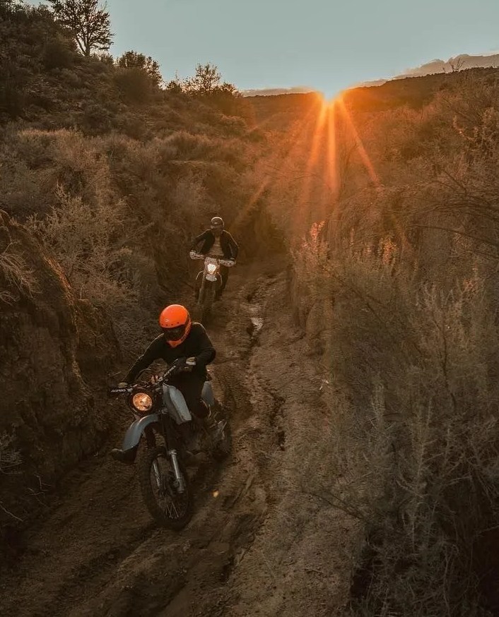 roark men riding motorbikes down dirt path