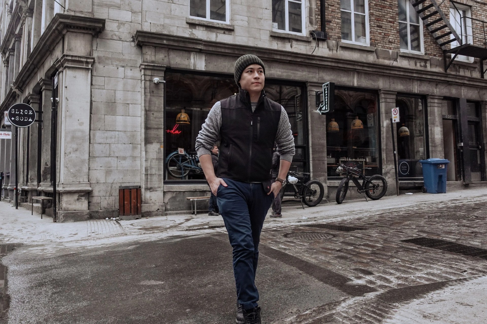 man crossing street wearing ewool clothing