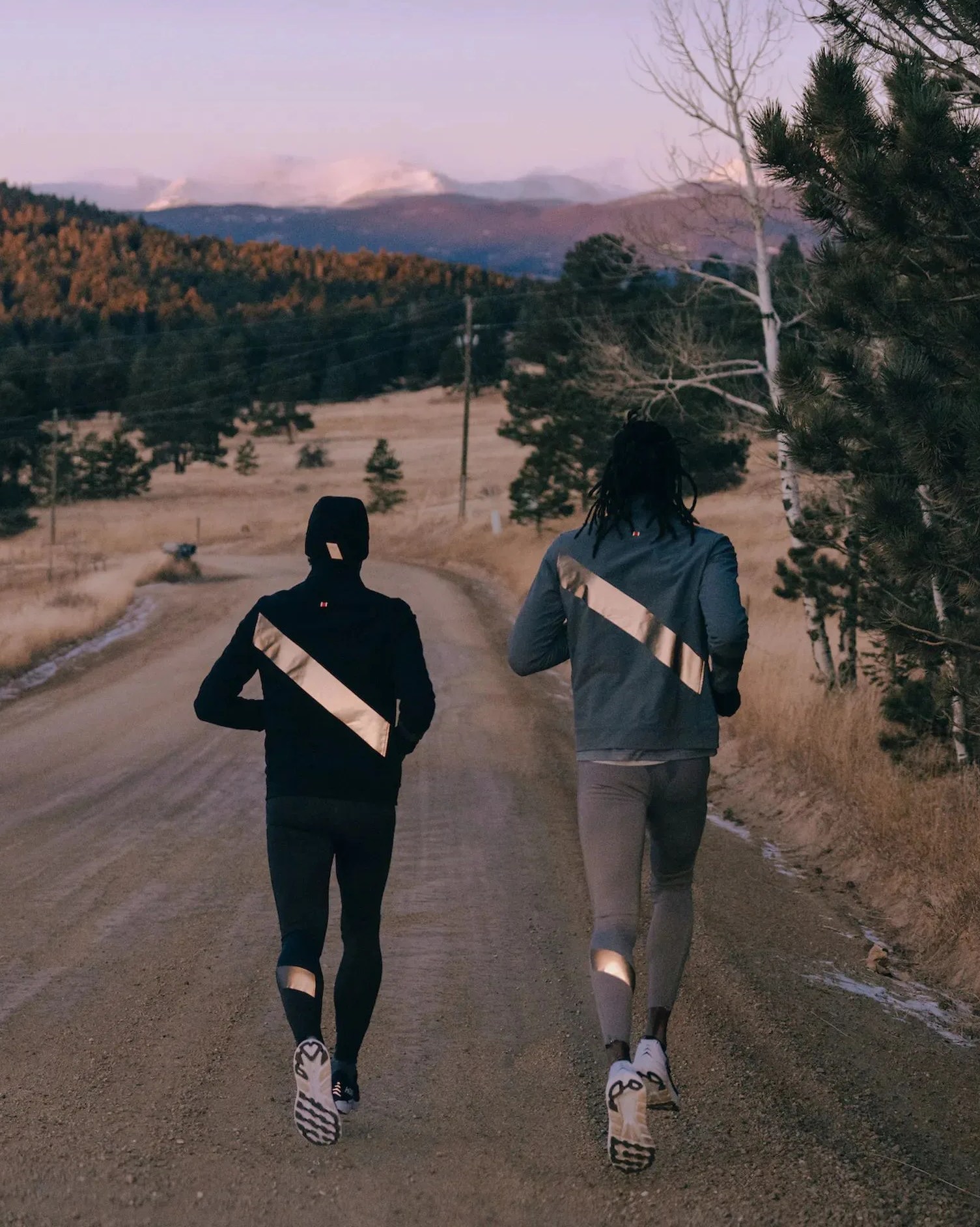 two people running along road wearing tracksmith's no day off collection
