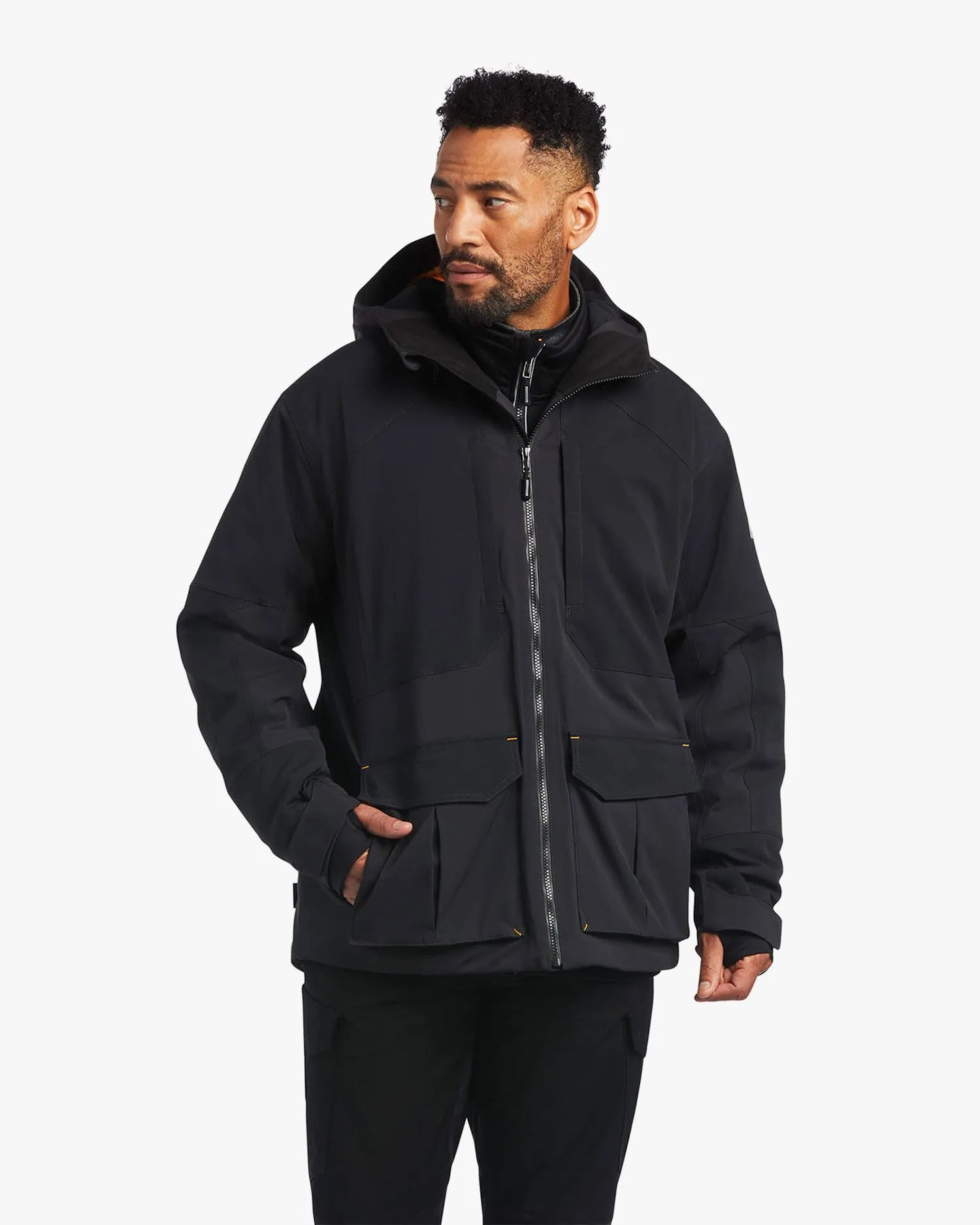 man wearing rebar polartec elite waterproof insulated jacket
