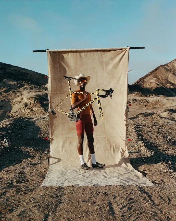 man holding onguza bicycle