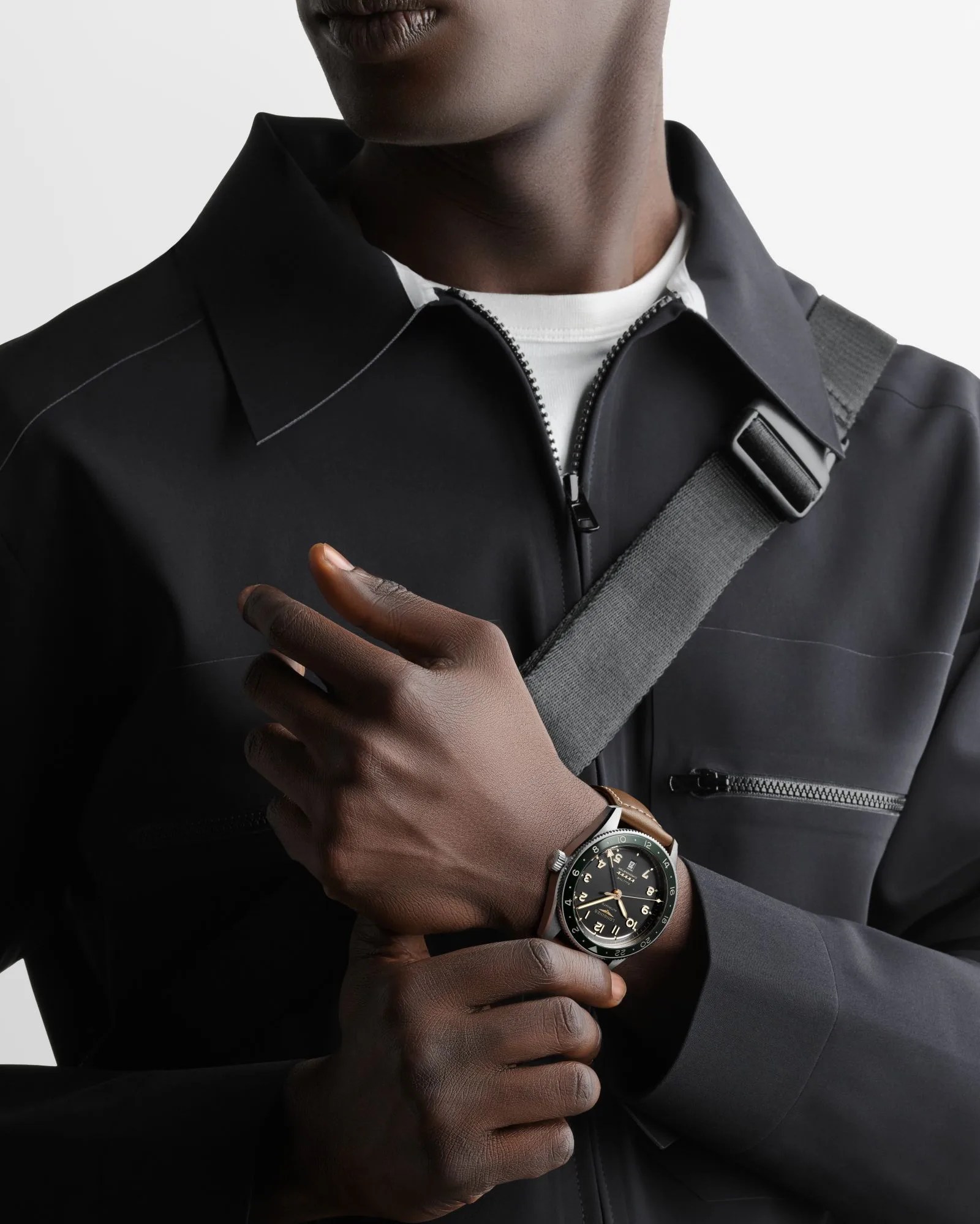 man wearing longines sprit zulu time gmt watch