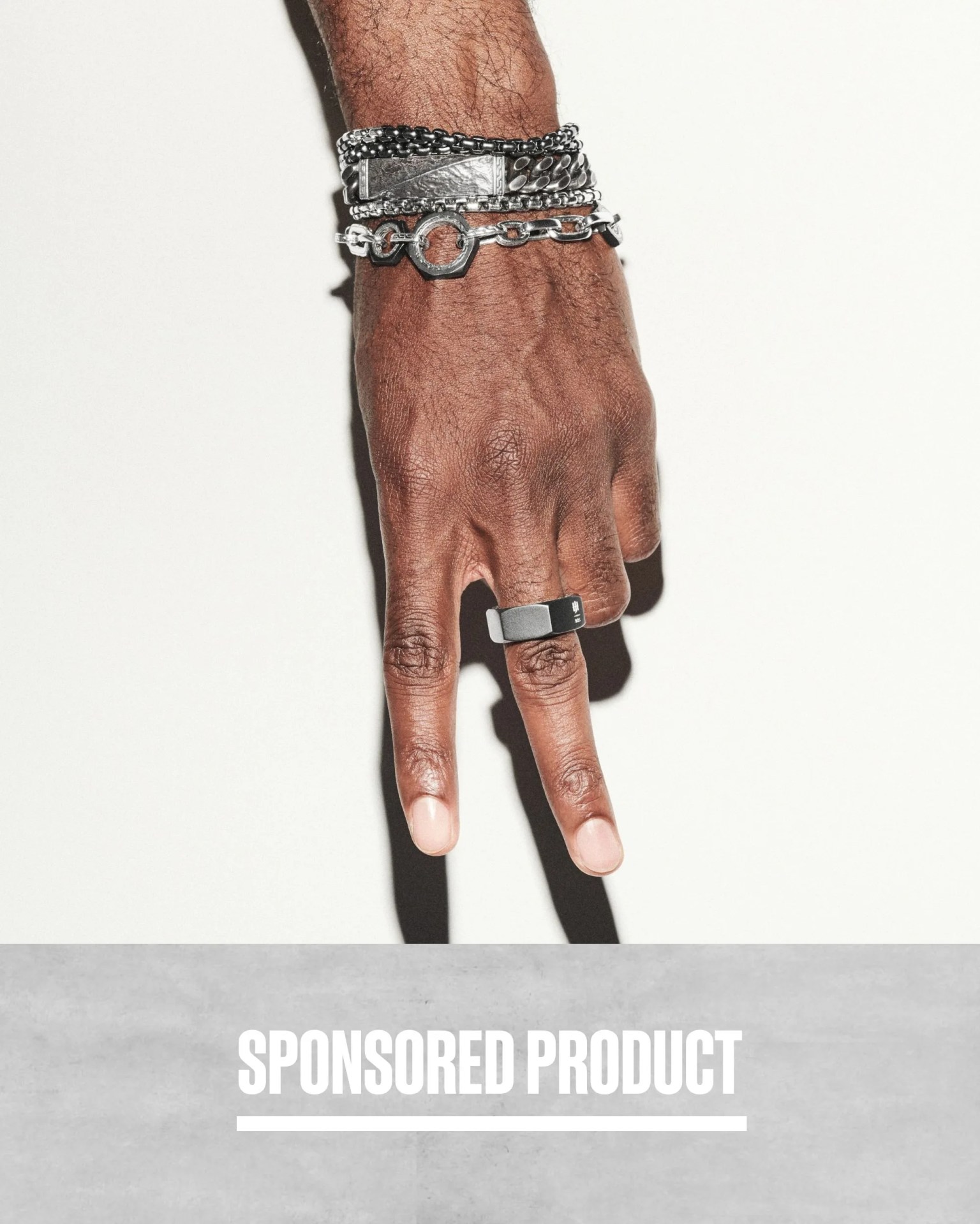 sponsored product hand wearing john hardy jewelry