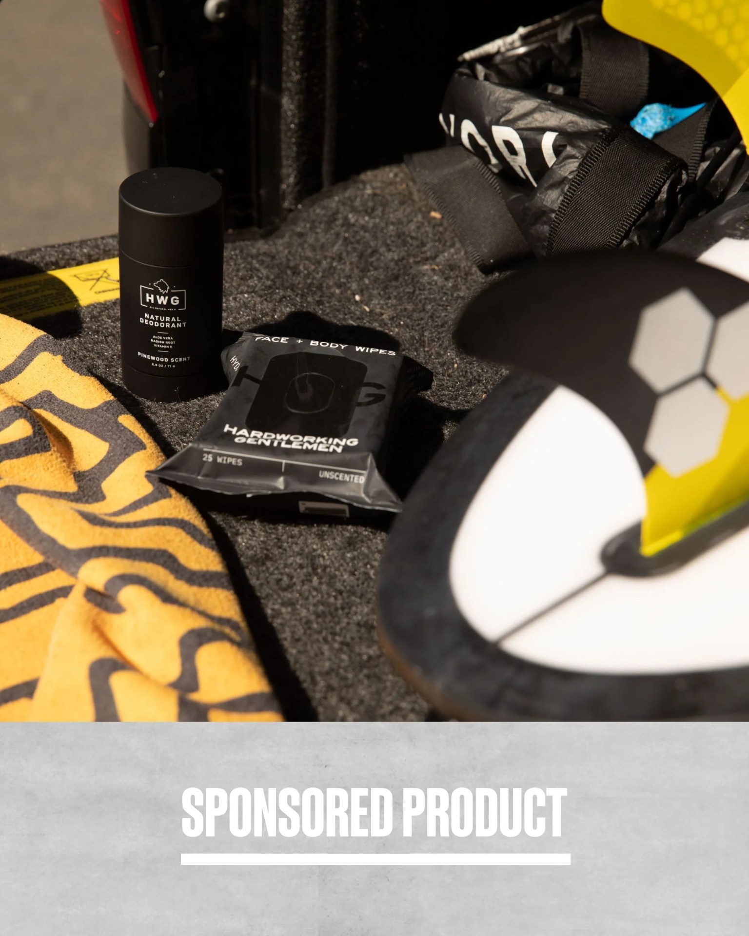 sponsored product hardworking gentleman deodorant and wipes placed next to a towel and surfboard