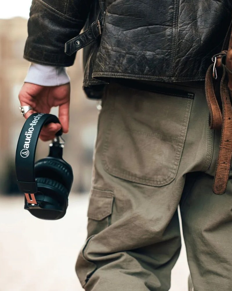 today in gear april 11 2022 man holding audio technica headphones