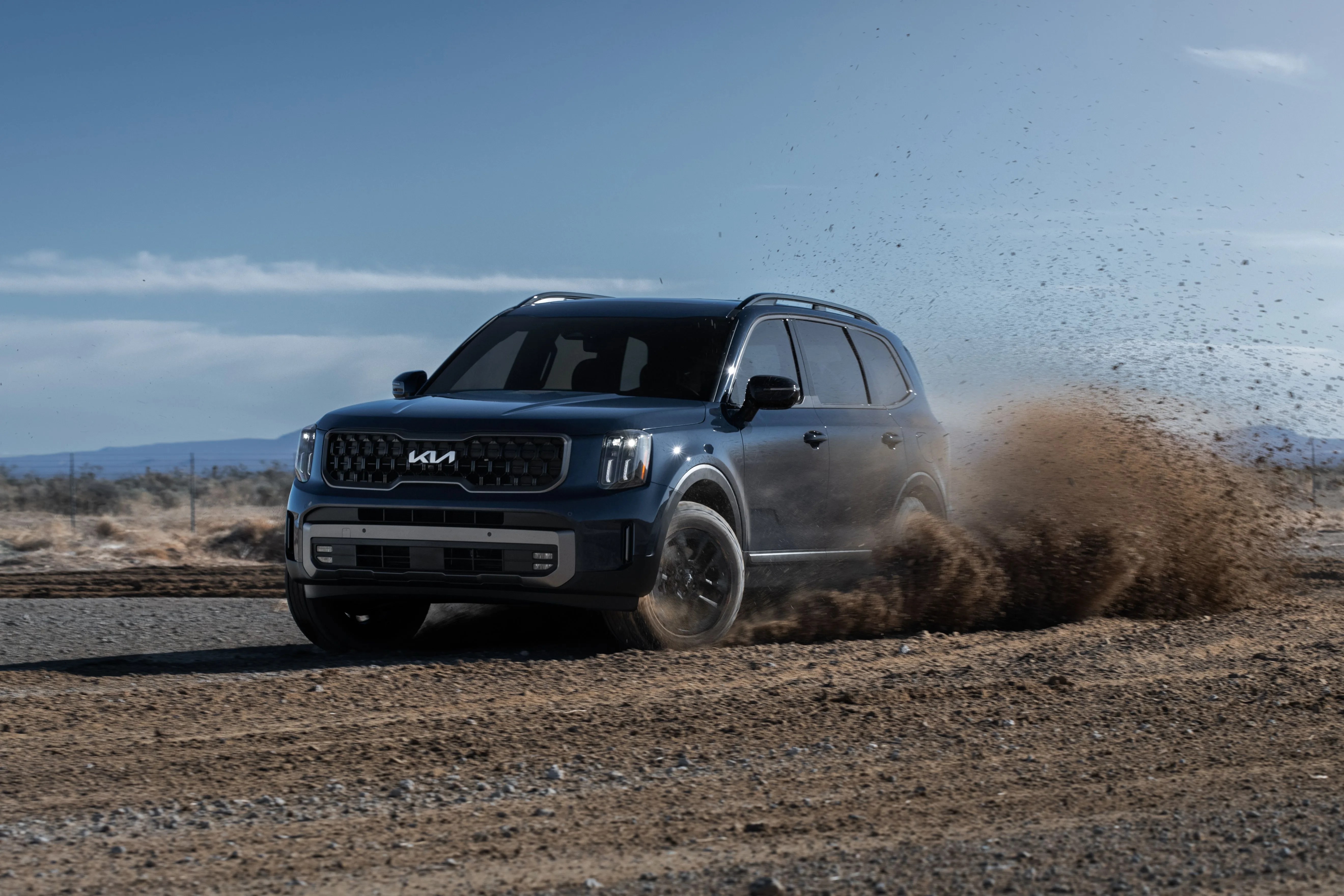 kia telluride power sliding through dirt