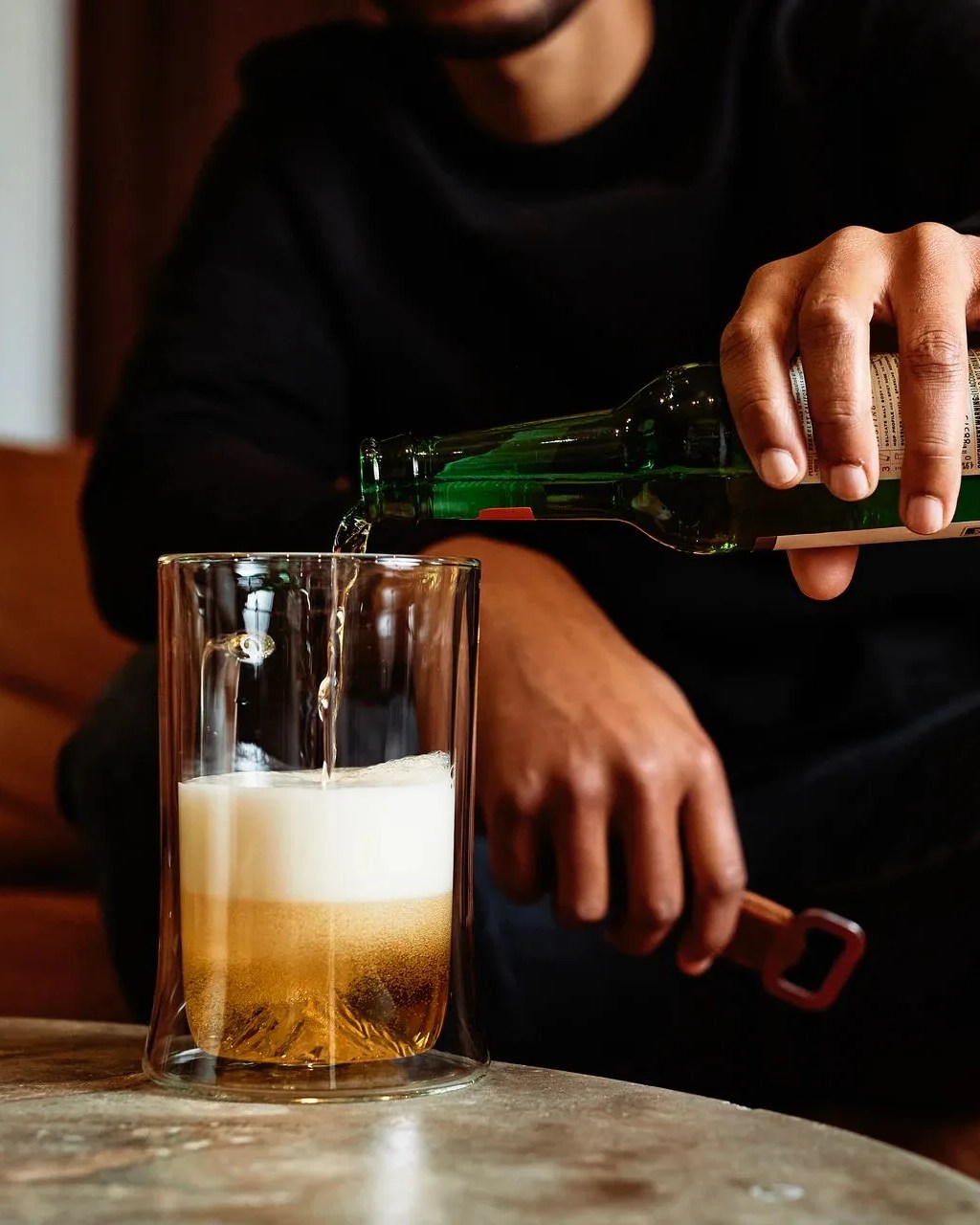 man pouring beer into whiskey peaks double wall beer stein
