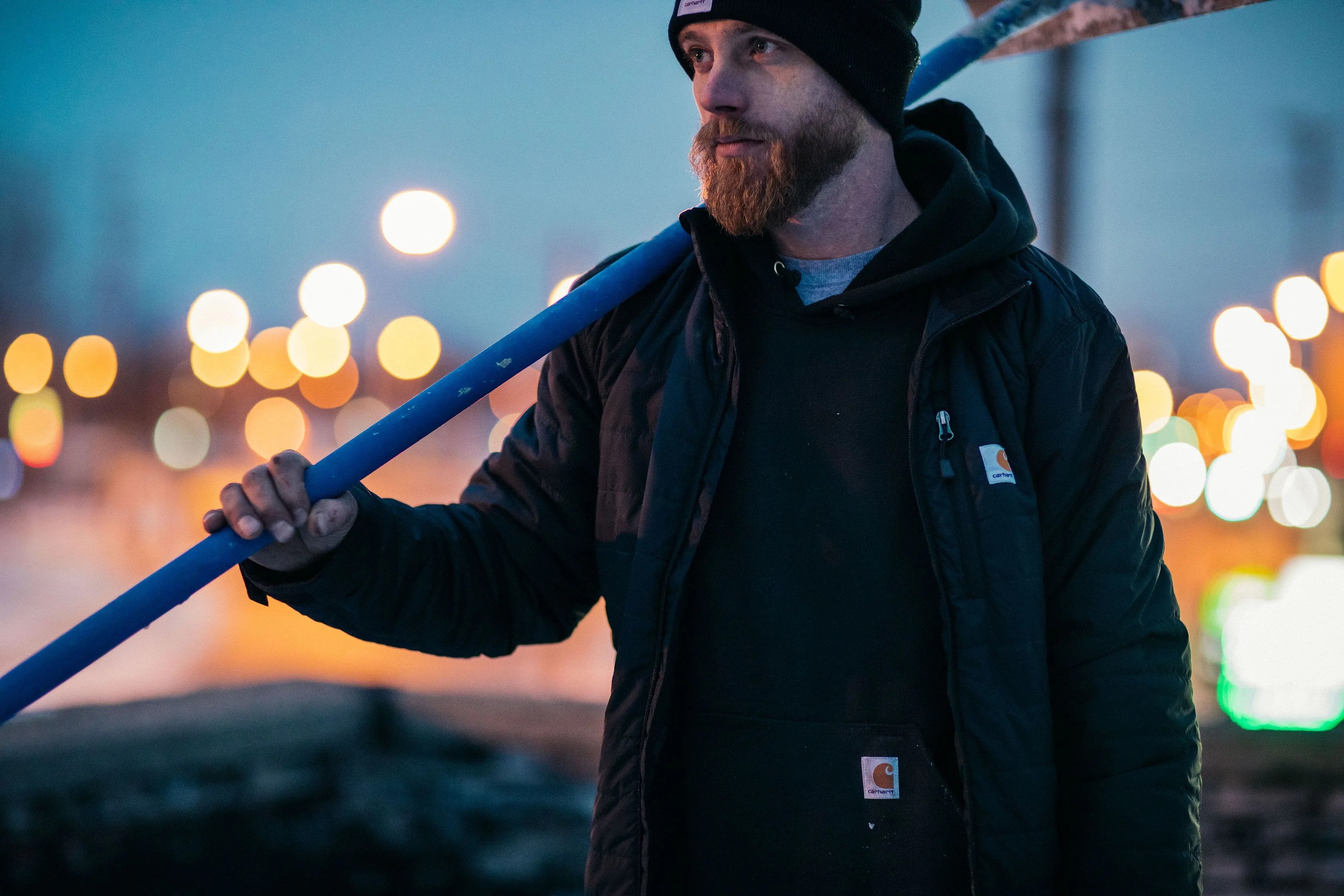 man wearing carhartt rain jacket