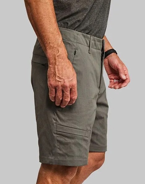 man wearing vollebak's equator shorts in grey