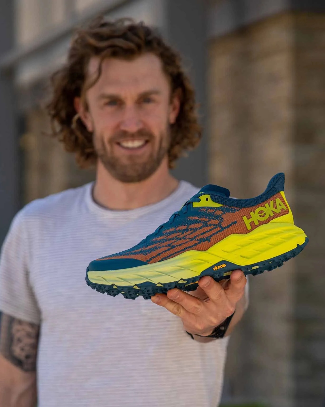 jared smith holding hoka speedgoat 5 shoe