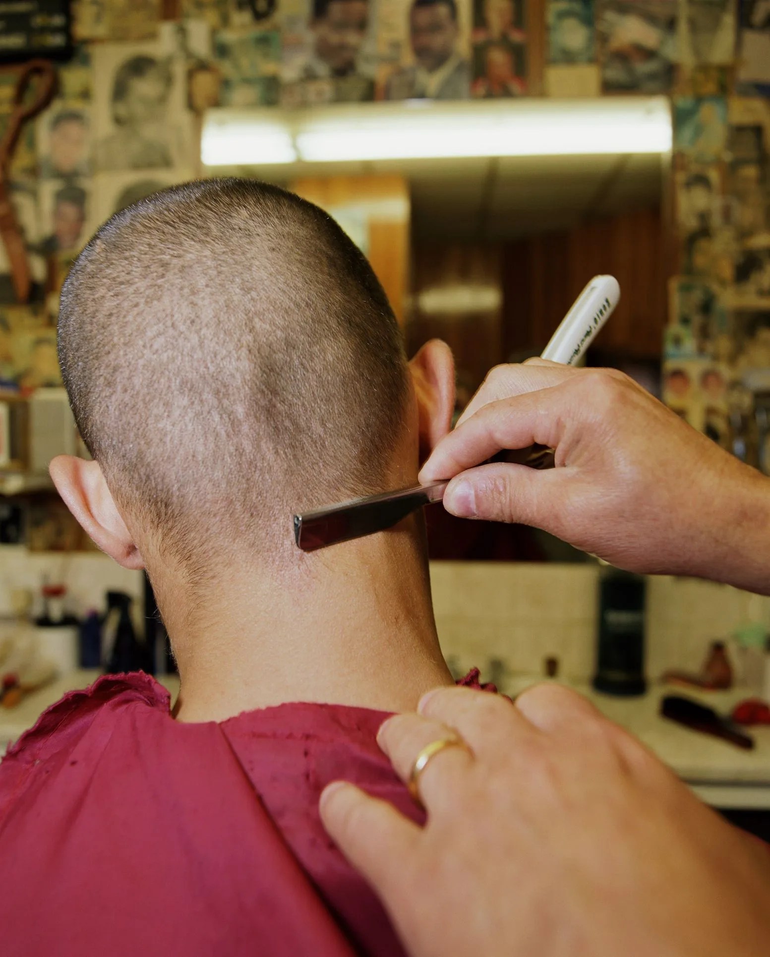 man having haircut rear view, close up