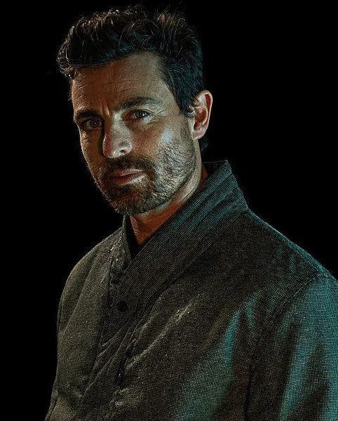 man wearing vollebak off grid jacket