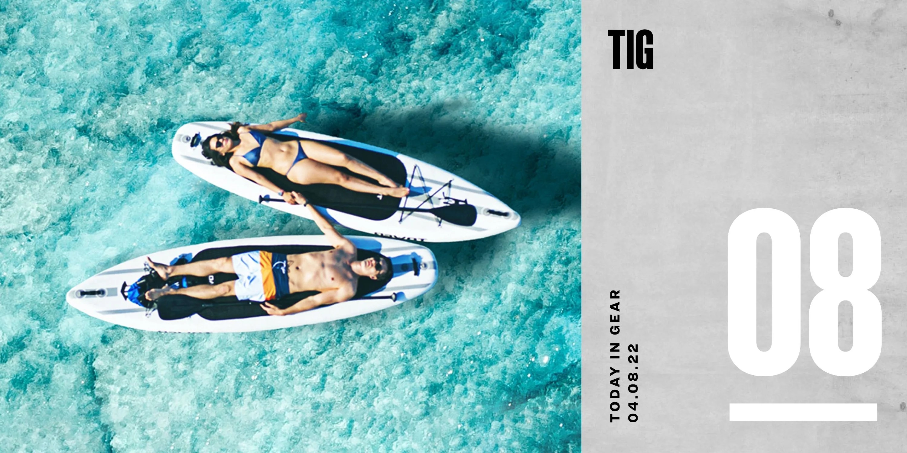 today in gear april 8 2022 a man and woman holding hands while laying on their back on top of a surfboard floating in water