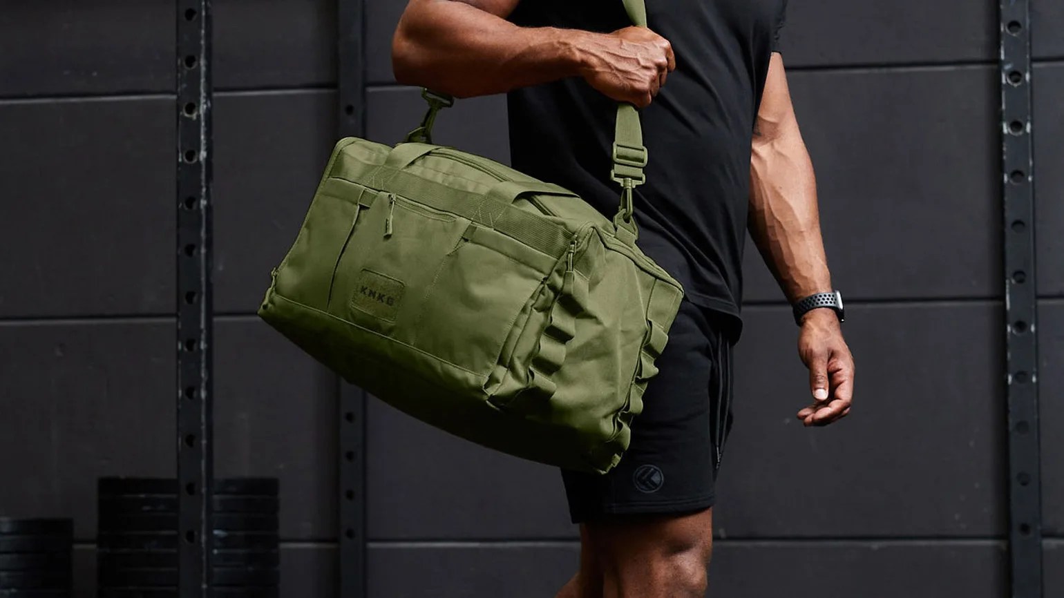 King Kong core gym duffle in green being carried by athlete