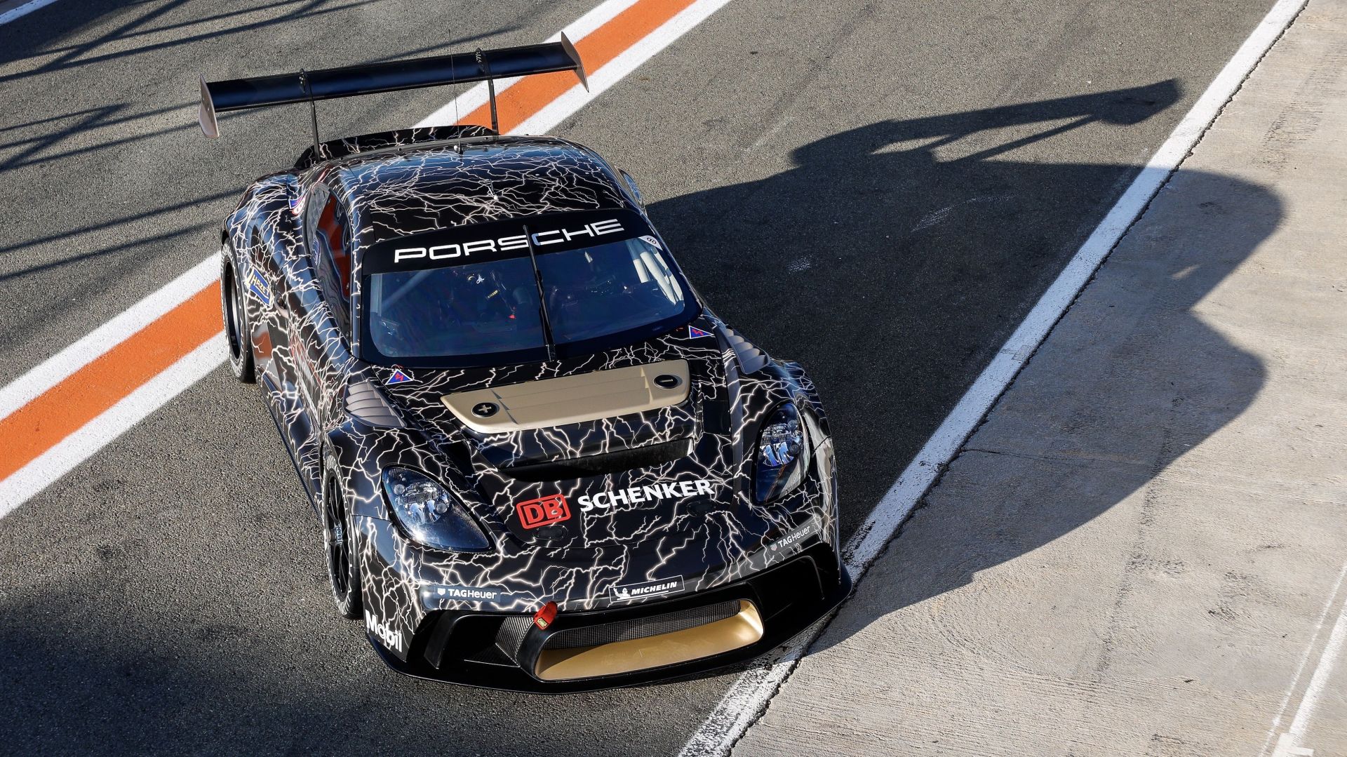 porsche 718 gt4 eperformance on track