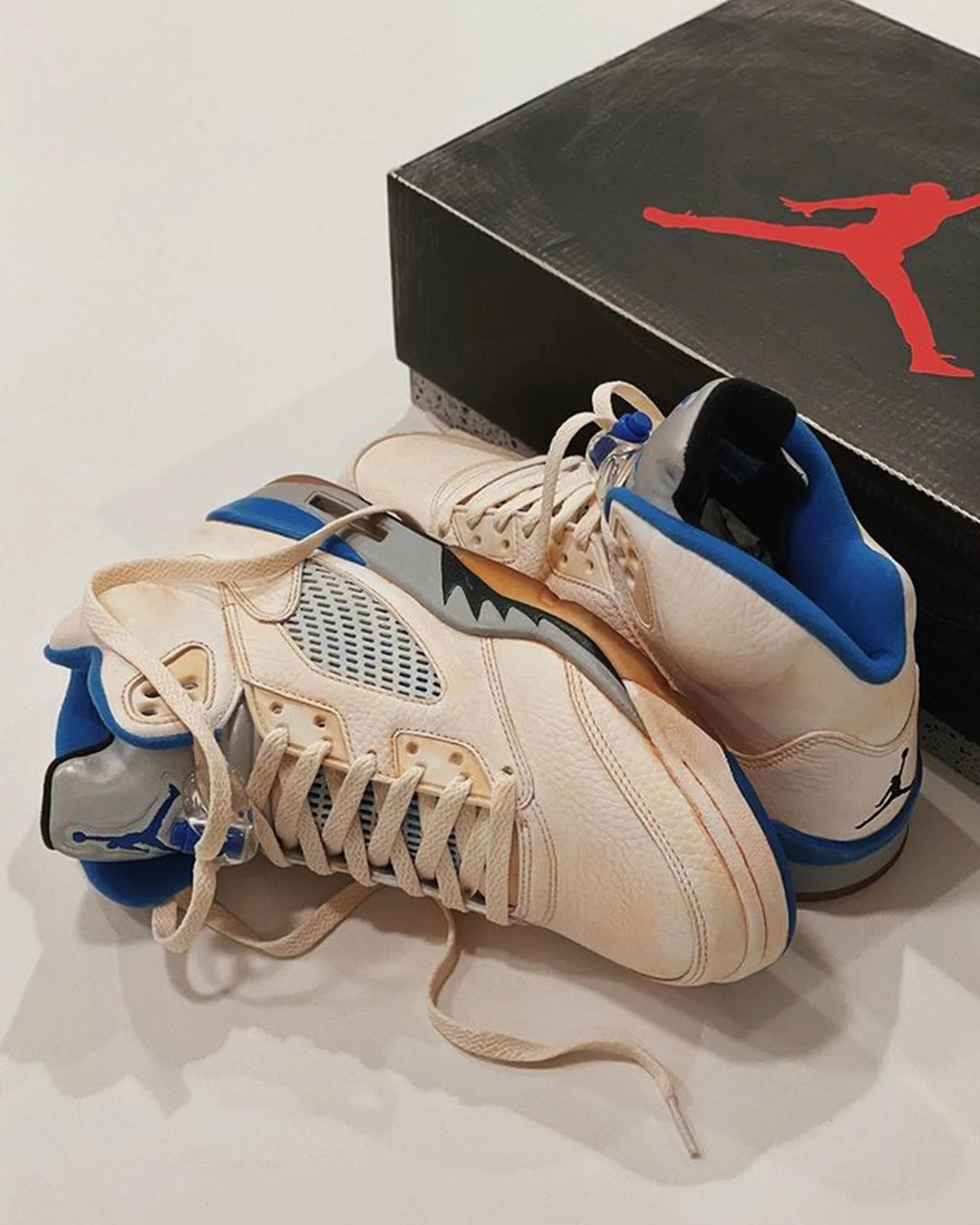 stealth 5s and military blue 4 sneakers