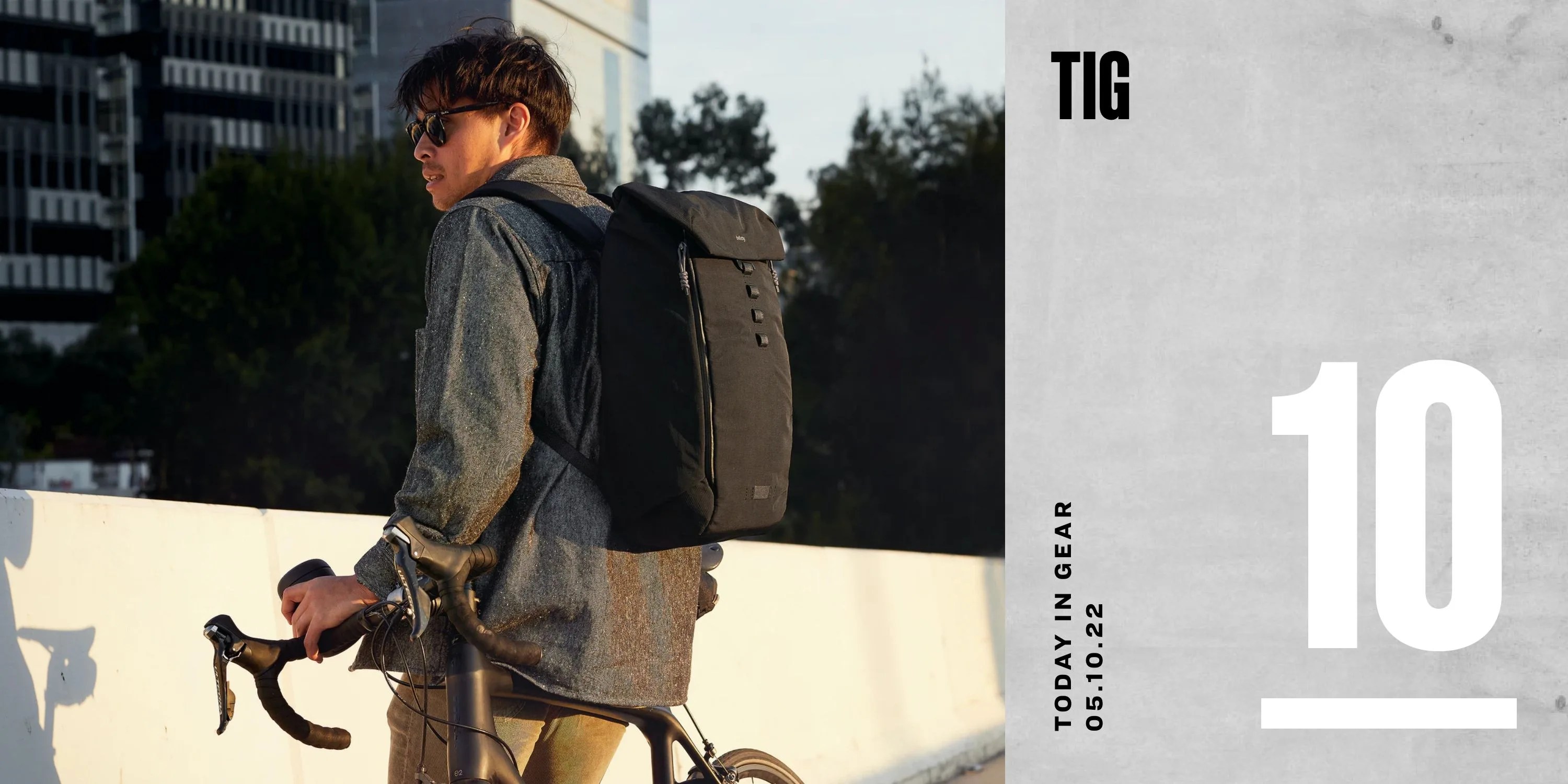 today in gear may 10 2022 man wearing bellroy venture backpack 22l leaning on bike
