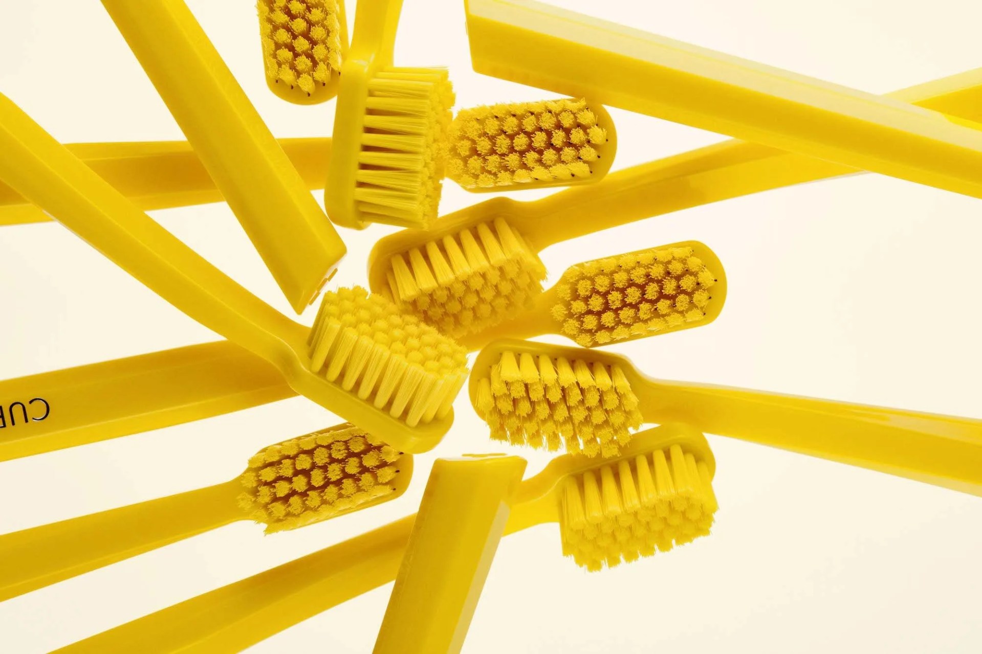 twice toothbrushes in a pile