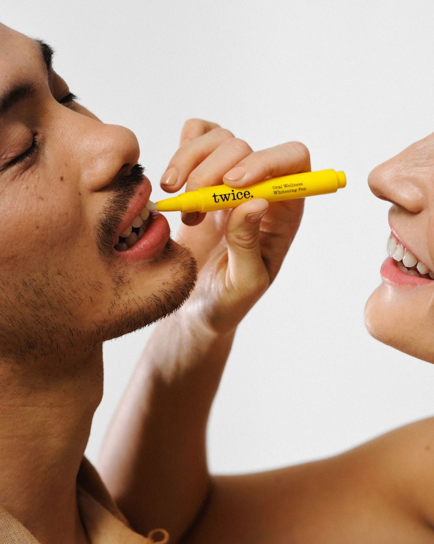 twice whitening tool being applied on the front teeth