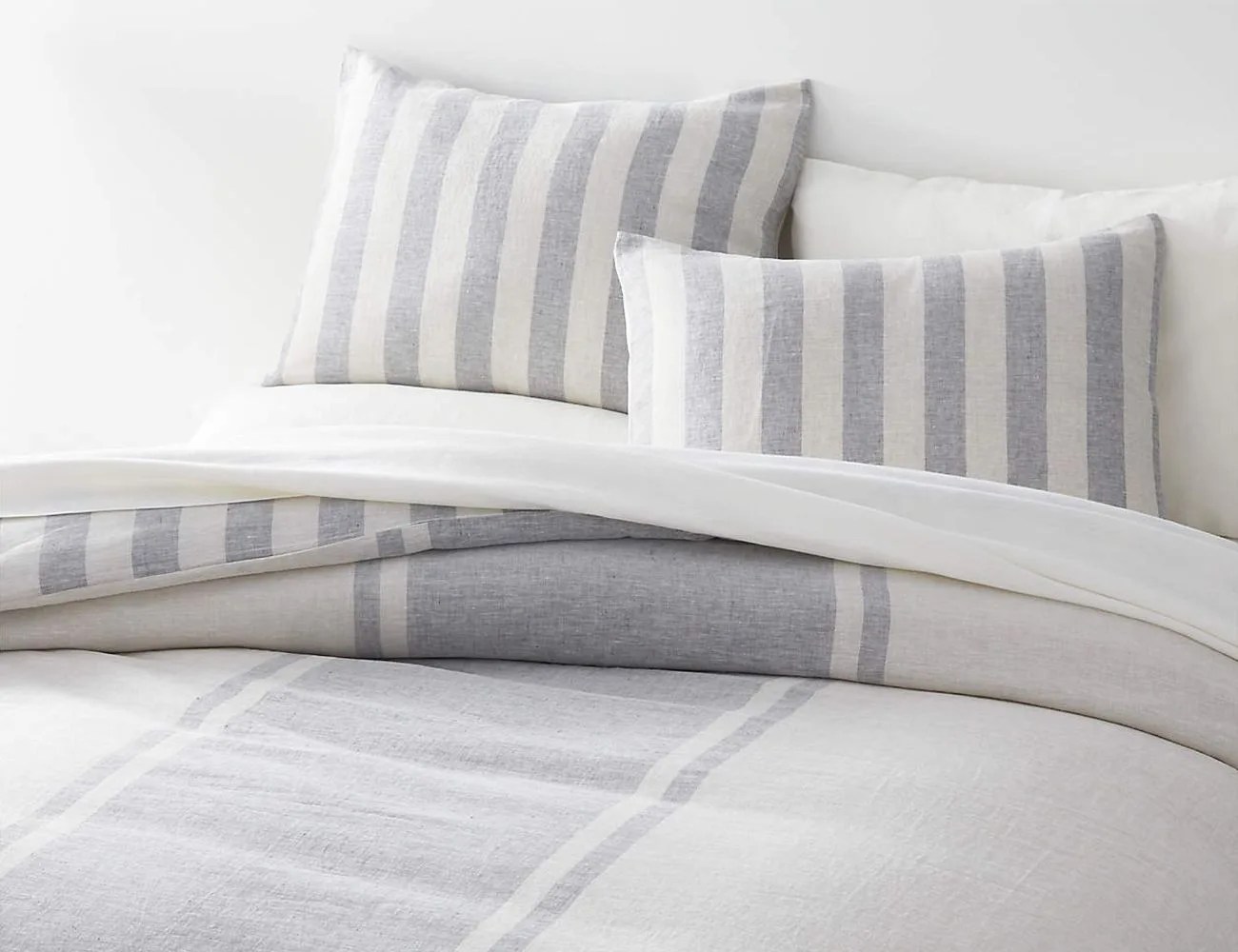 gray and white striped duvet cover on a bed