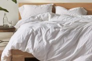 white coyuchi duvet cover on bed