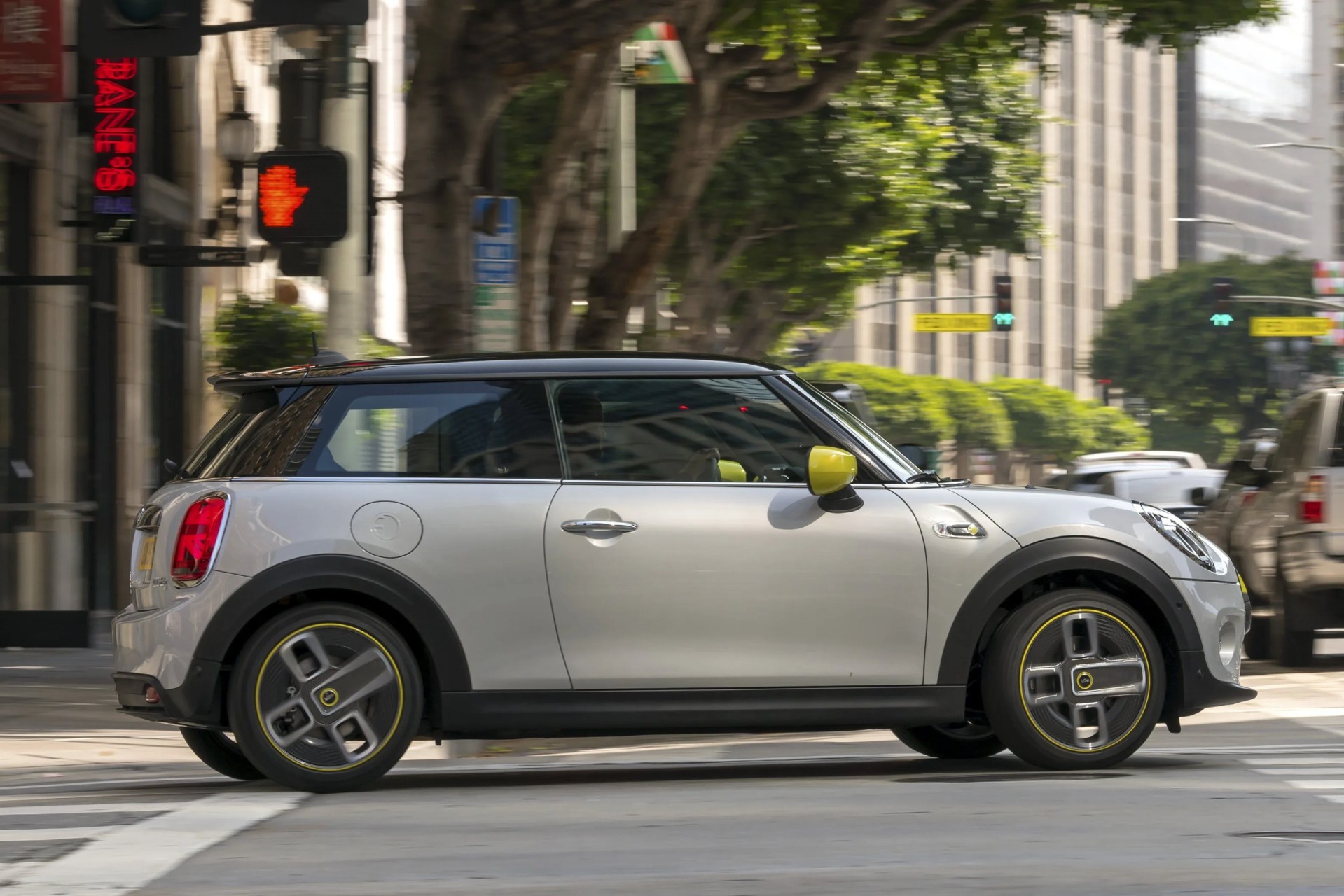electric mini driving on a city street