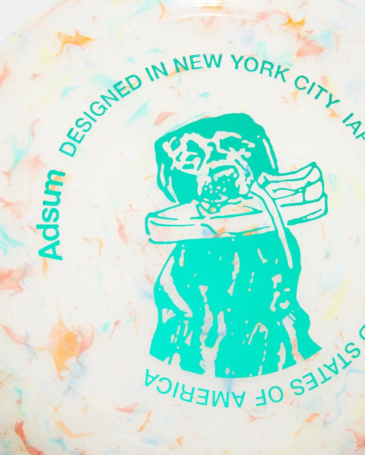 adsum recycled frisbee with an illustration of a dog holding a shoe in it's mouth