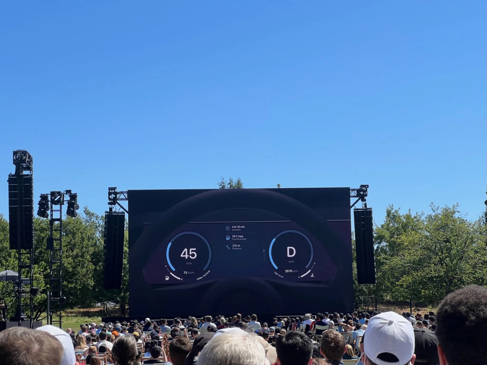 apple carplay instrument display shown on large screen from live event