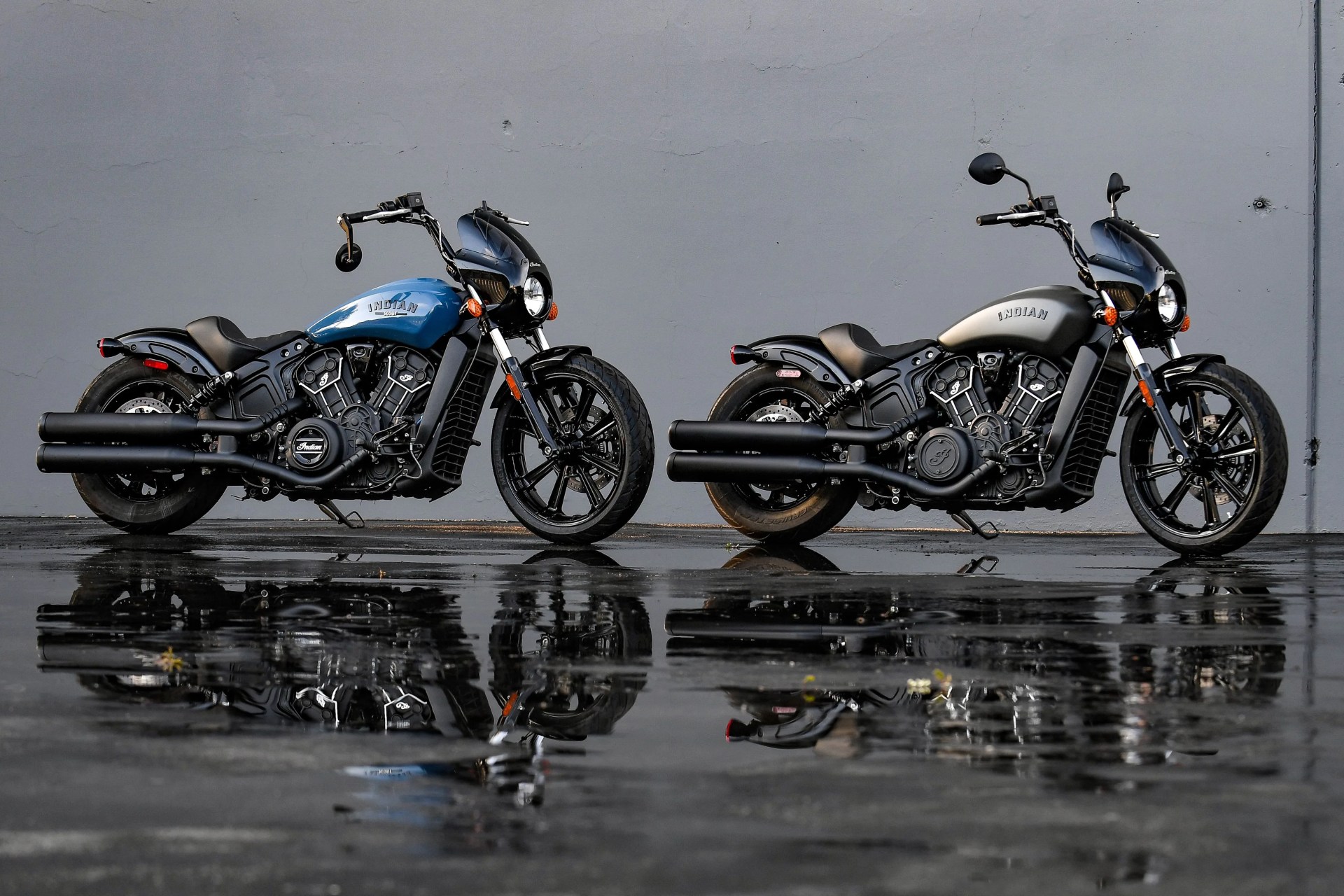two indian motorcycles parked