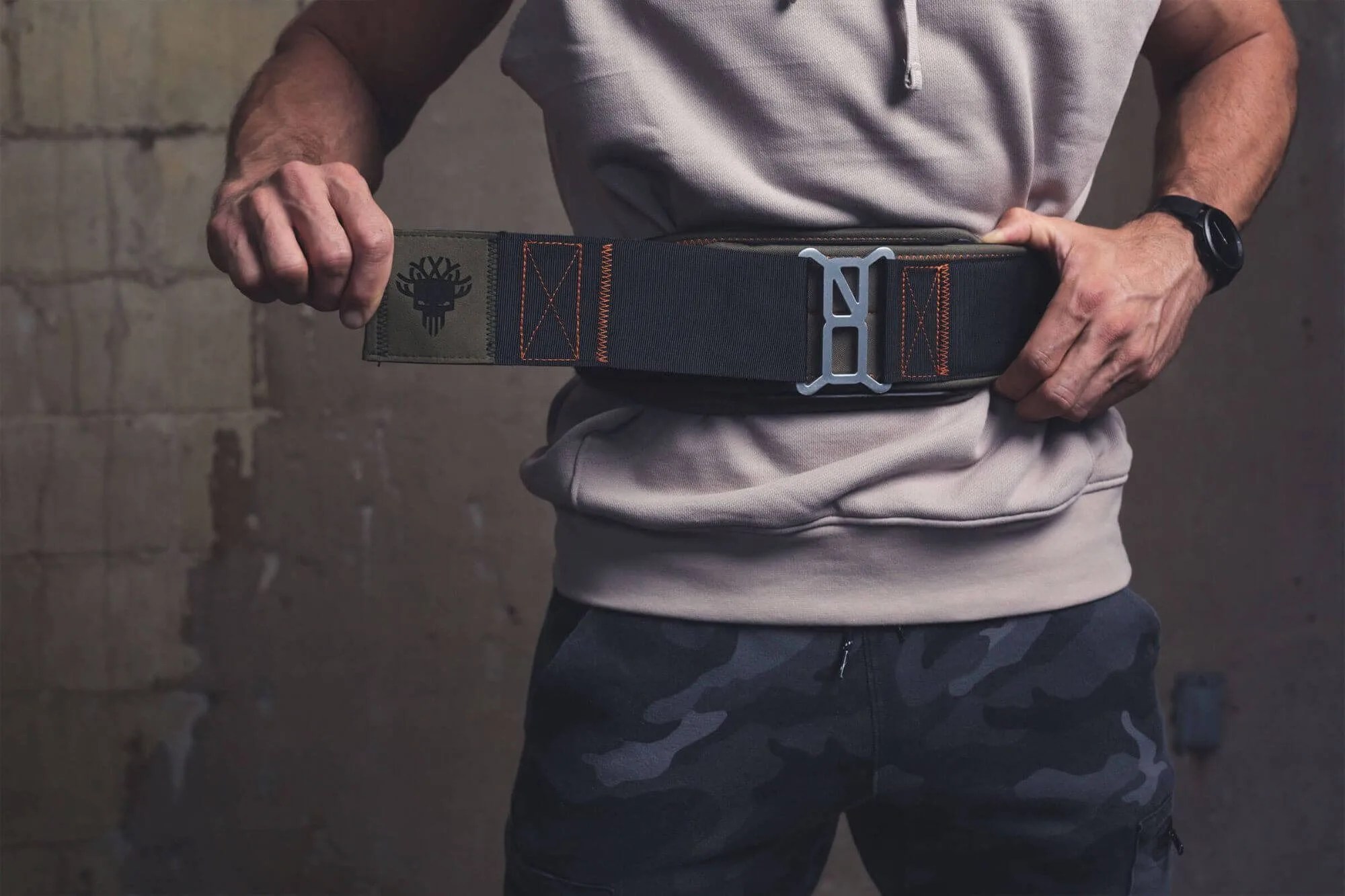 man adjusting lifting belt