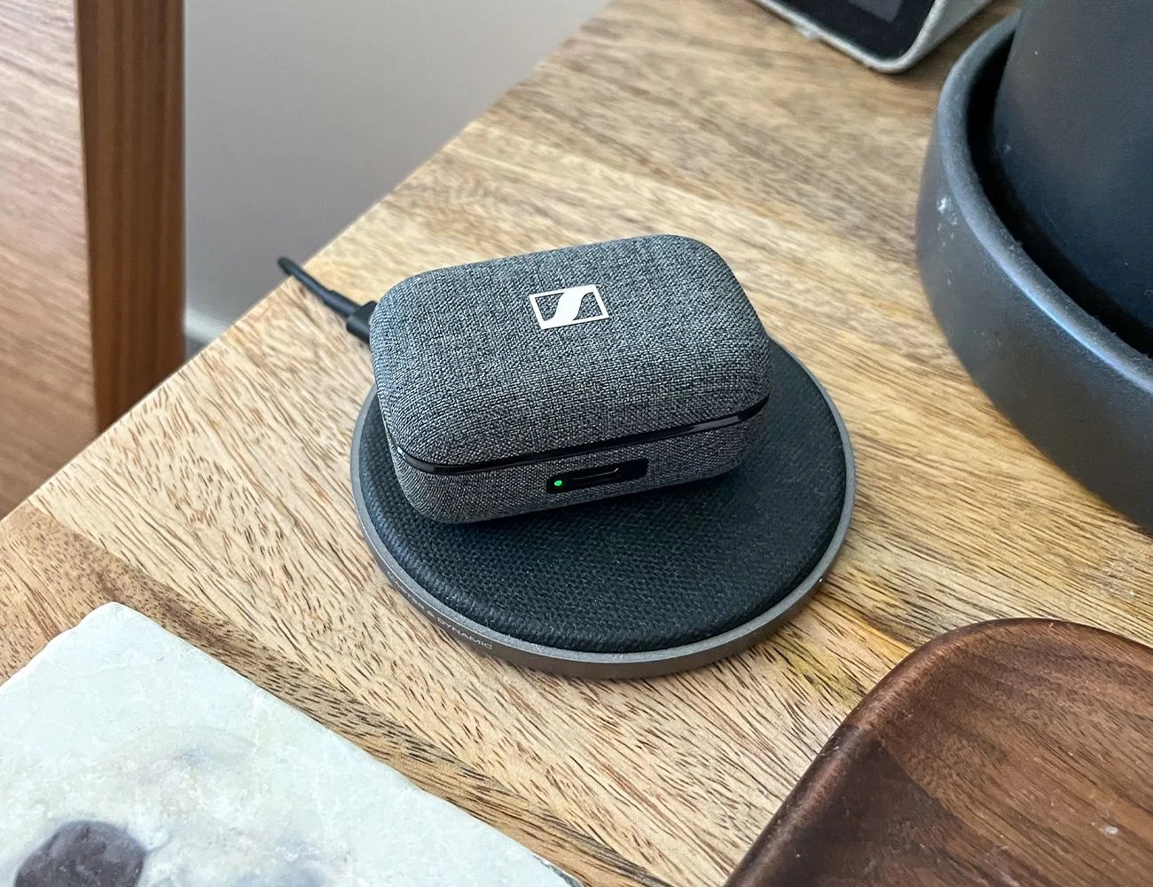 sennheiser momentum true wireless 3 charging on a table