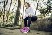 woman wearing pink puma run xx nitro sneakers
