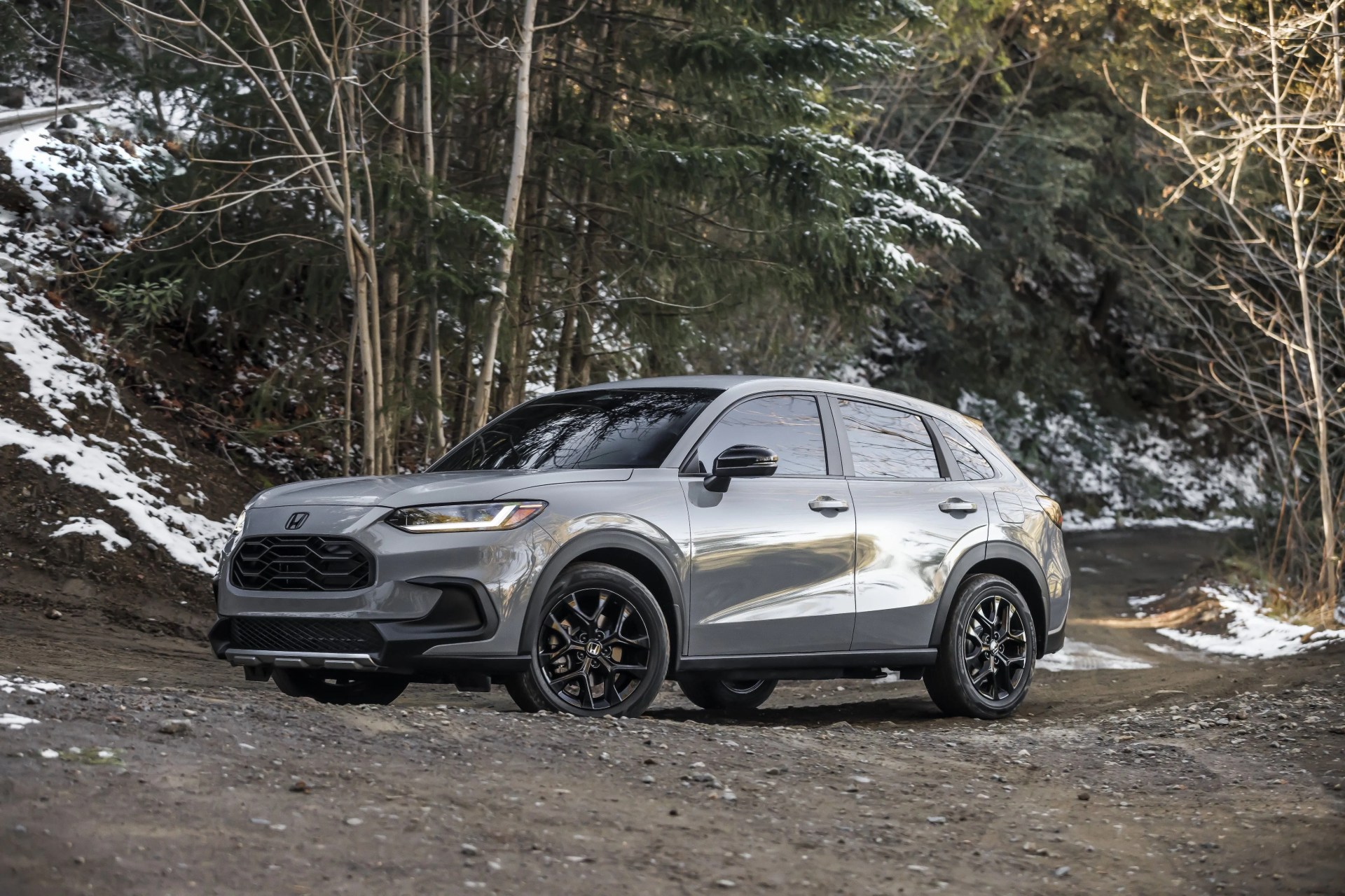 2023 honda hr v crossover parked on snowy wooded trail