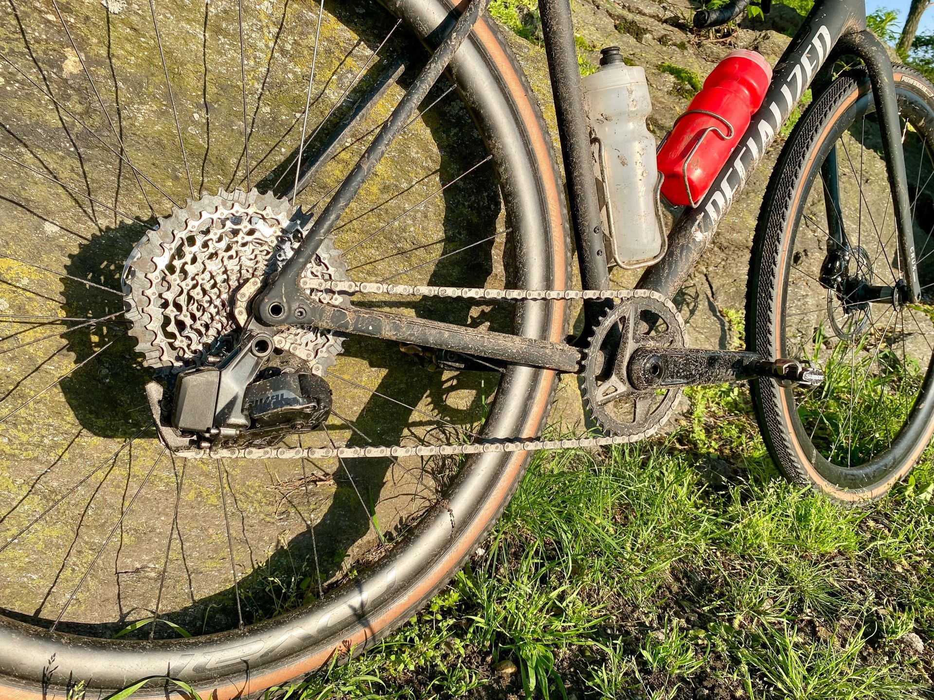 close up of the crux expert back tire, spokes, and pedal
