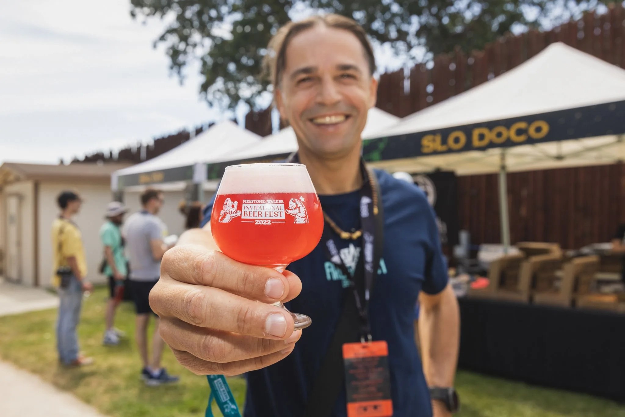 man holding a beer at the firestone walker invitational