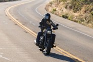 someone riding a honda rebel 1100 motorcycle along a curvy road