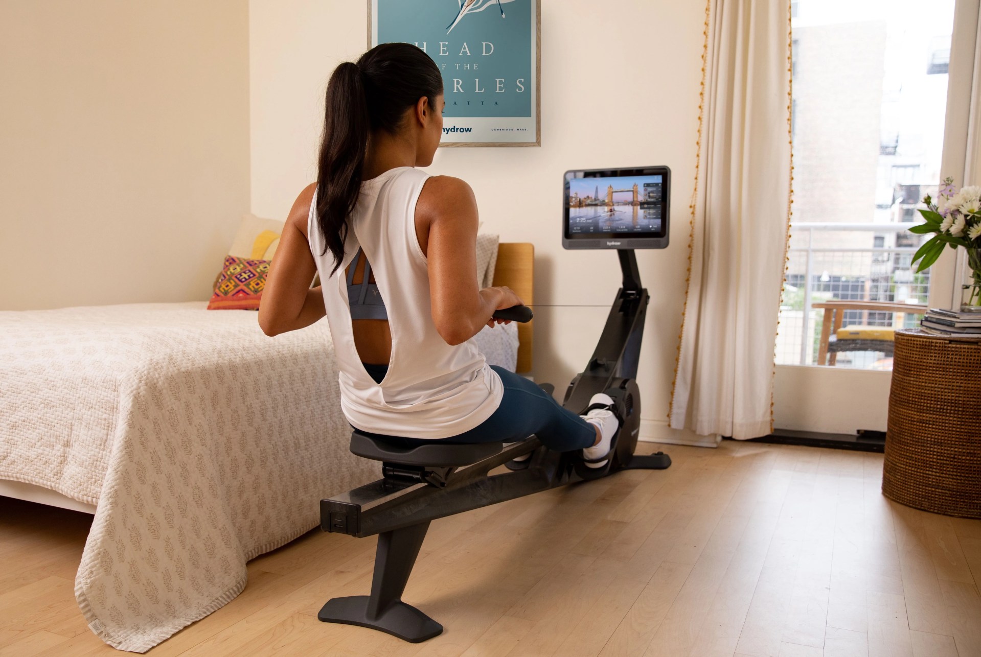 woman using a home workout rowing machine