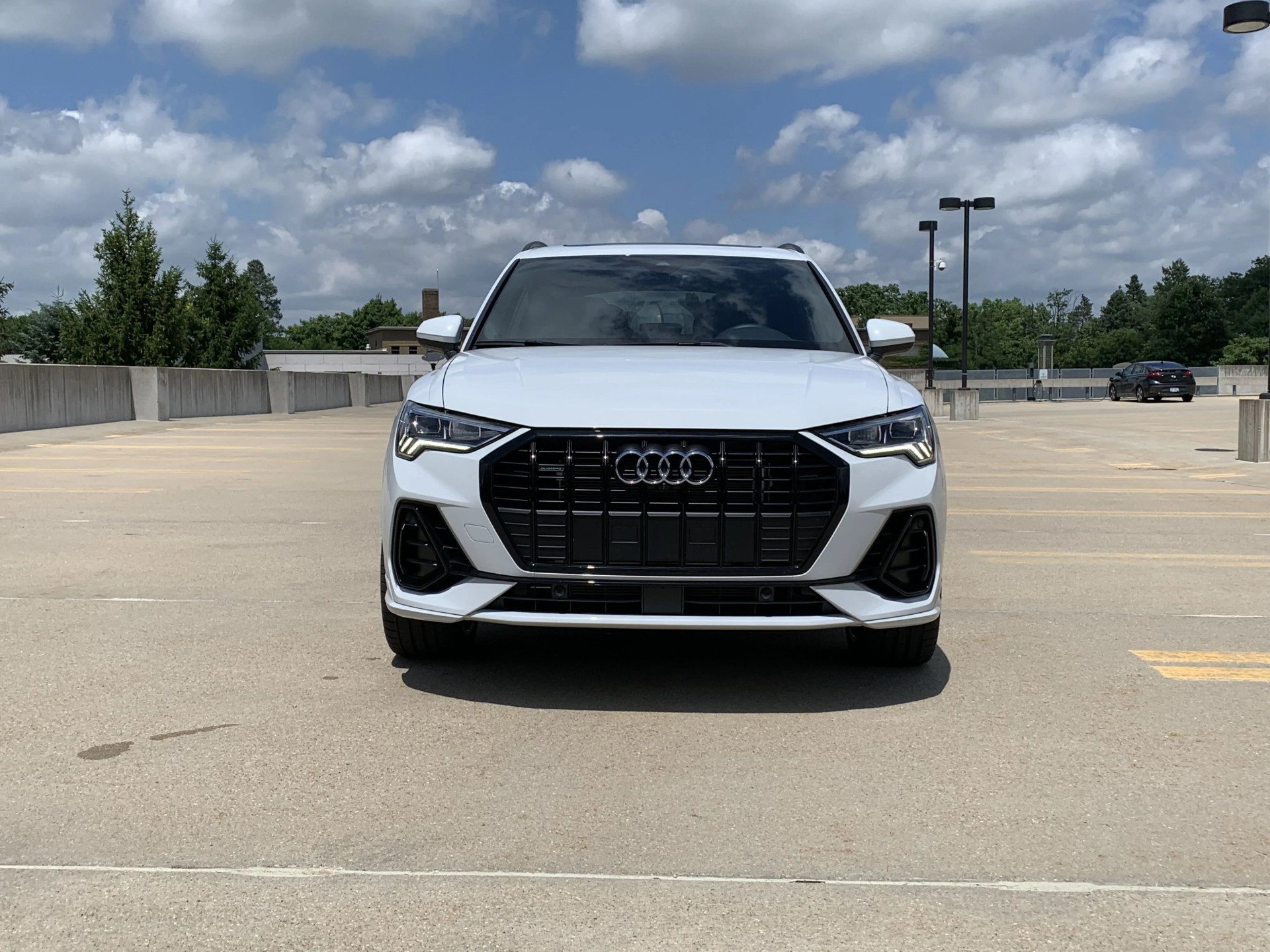 audi q3 viewed from the front parked in an empty science center parking lot